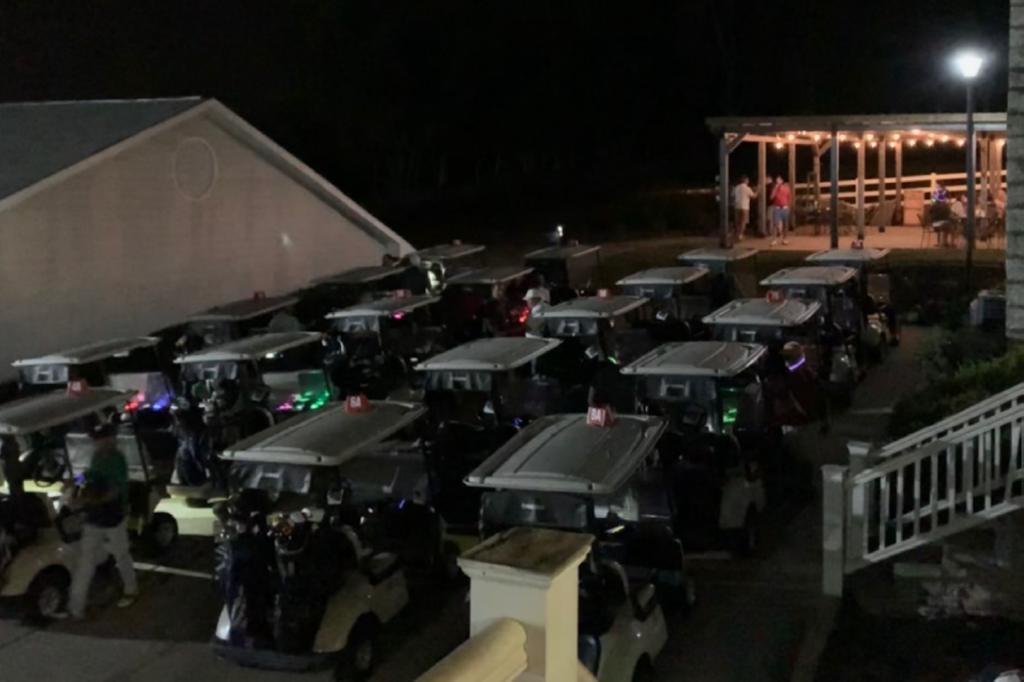 Rows of golf carts near golf course clubhouse