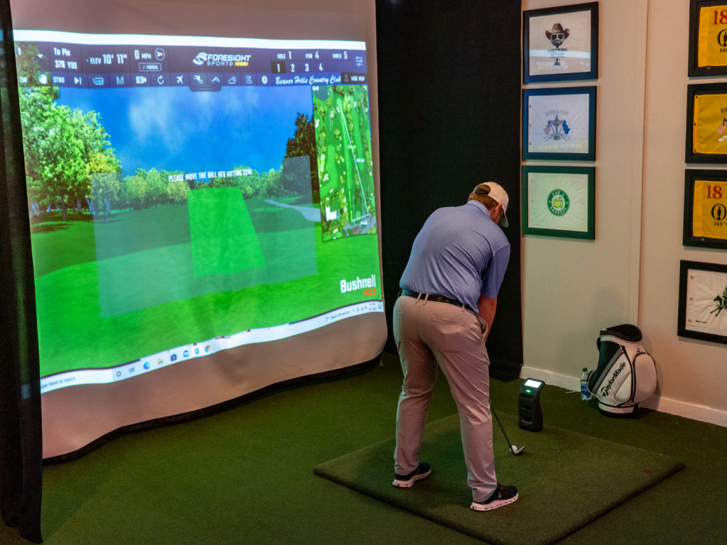 golfer practicing at Learning Center simulator